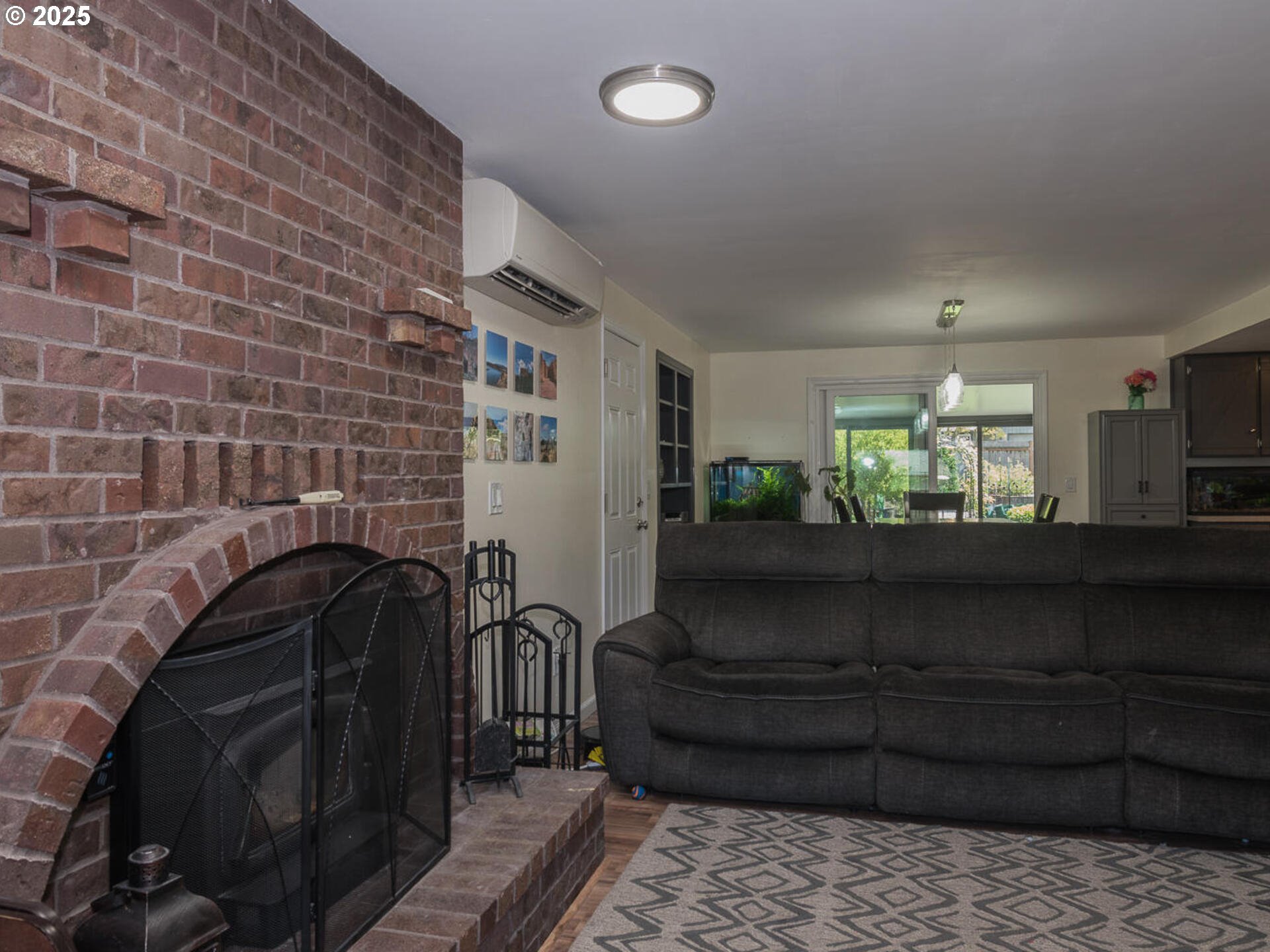 2548 Southeast Eagle Avenue Gresham, OR 97080 - Photo 13 of 32 a living room with furniture and a fireplace
