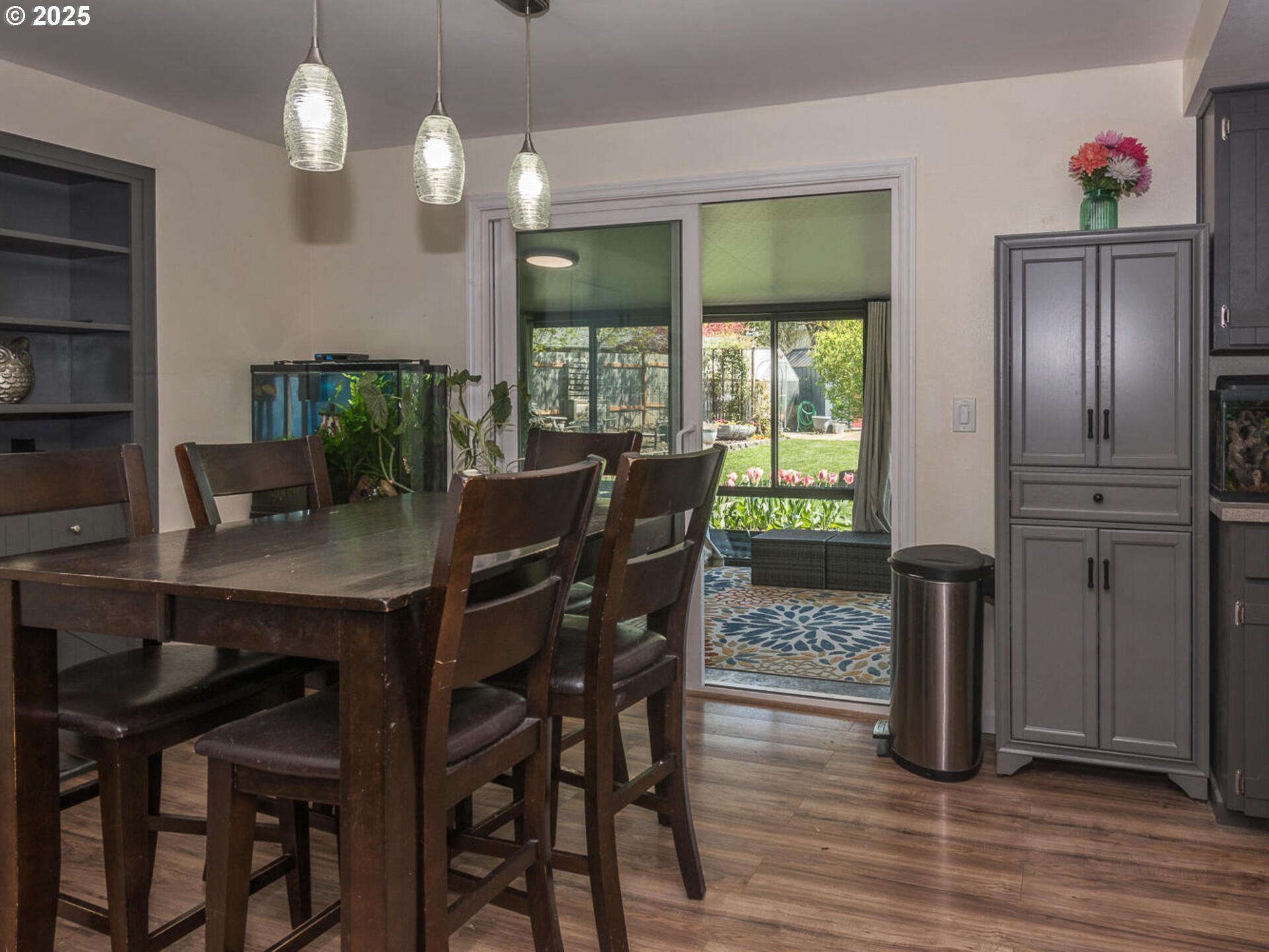 2548 Southeast Eagle Avenue Gresham, OR 97080 - Photo 15 of 32 a view of a dining room with furniture window and wooden floor