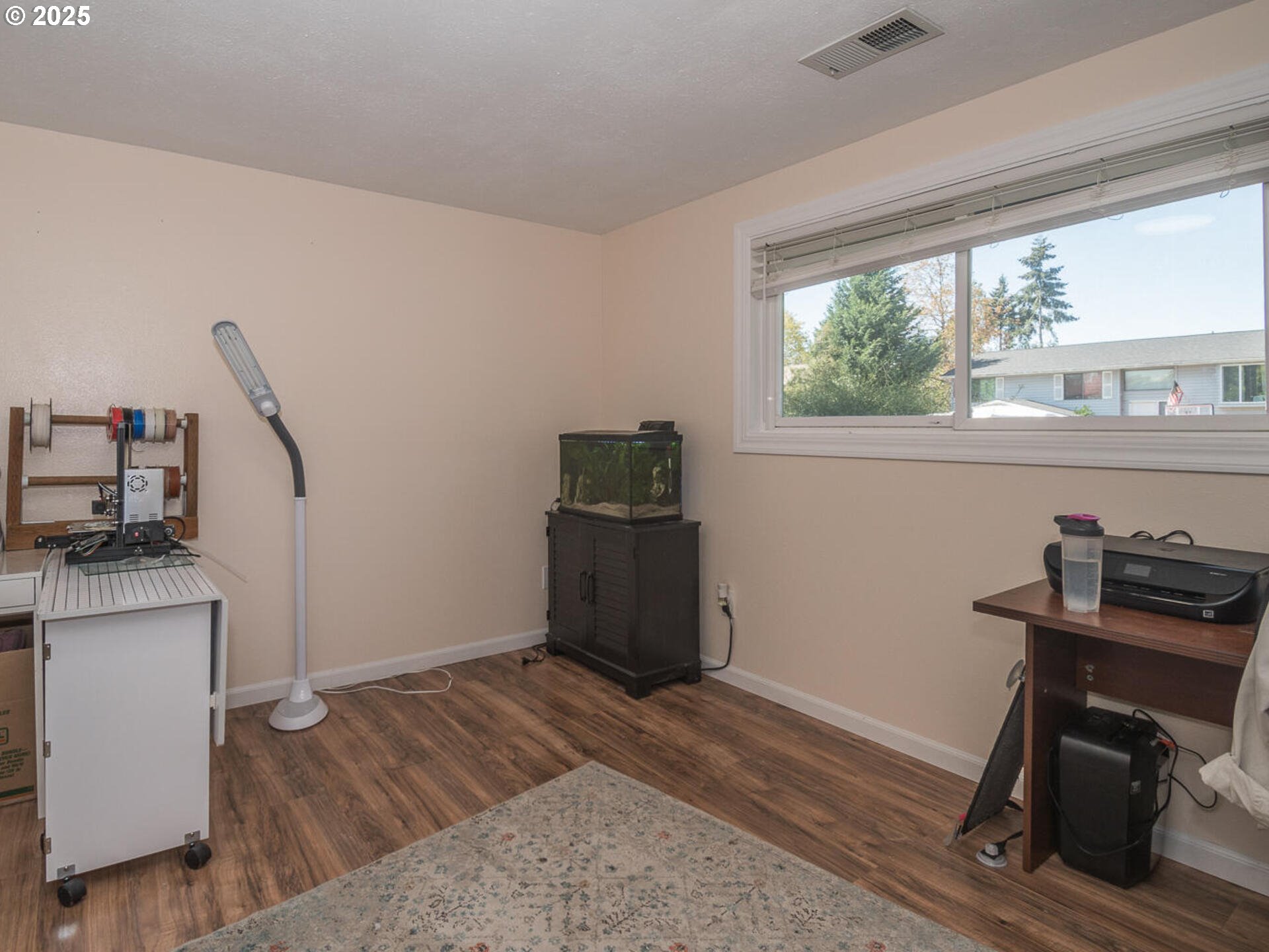 2548 Southeast Eagle Avenue Gresham, OR 97080 - Photo 29 of 32 a view of a workspace with furniture and a window