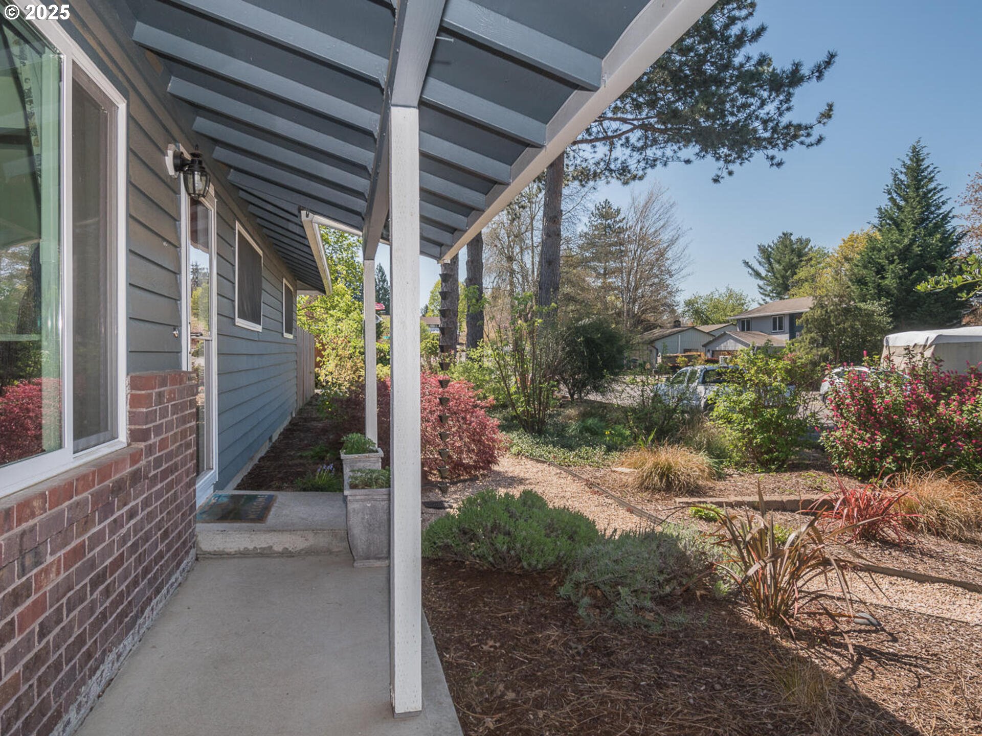 2548 Southeast Eagle Avenue Gresham, OR 97080 - Photo 5 of 32 a view of a house with a tree