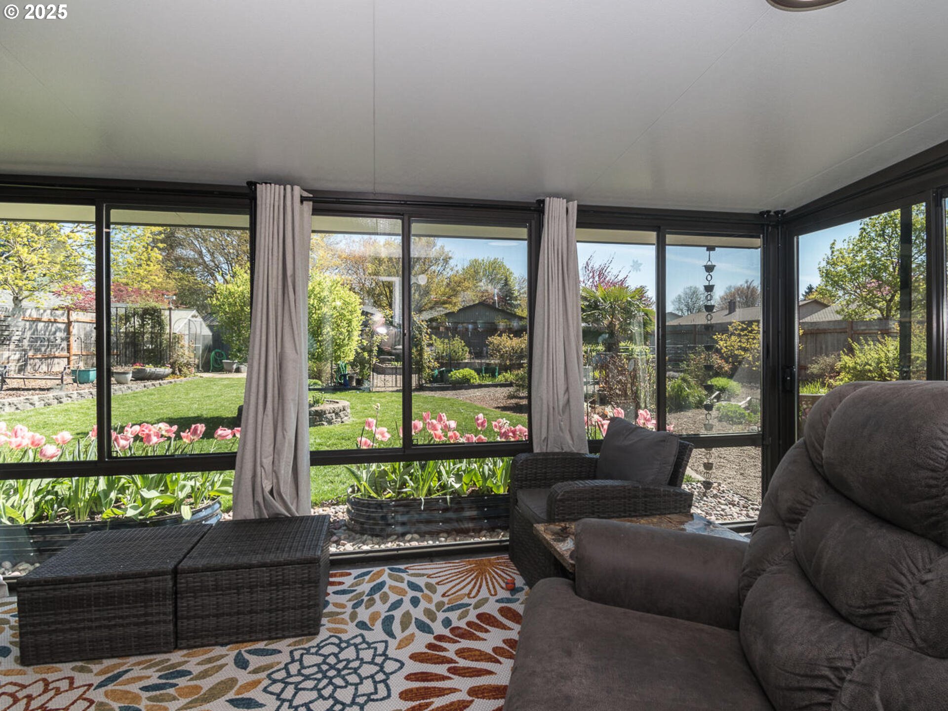 2548 Southeast Eagle Avenue Gresham, OR 97080 - Photo 9 of 32 a living room with couch coffee table and a floor to ceiling window