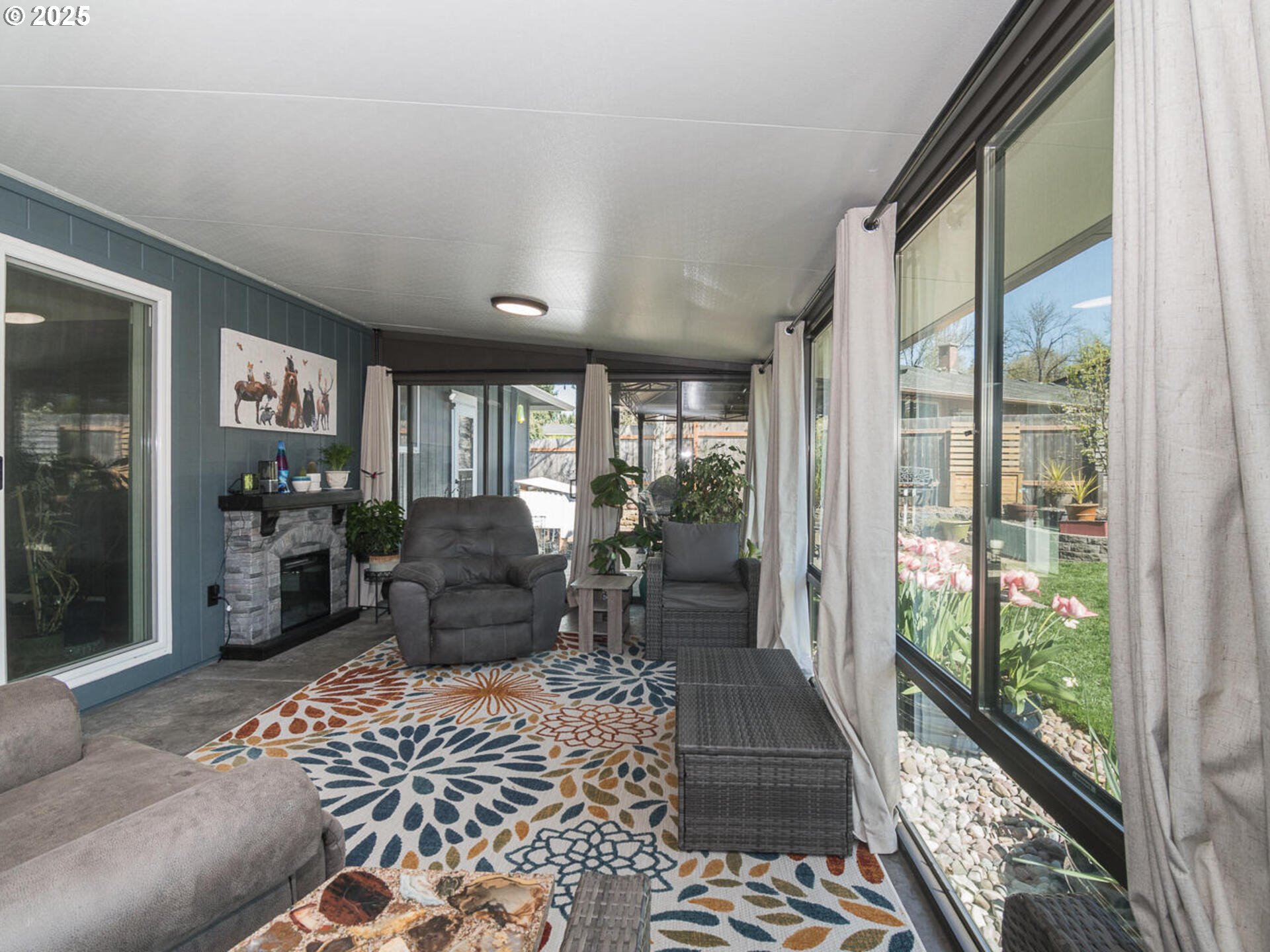 2548 Southeast Eagle Avenue Gresham, OR 97080 - Photo 10 of 32 a living room with furniture and a floor to ceiling window