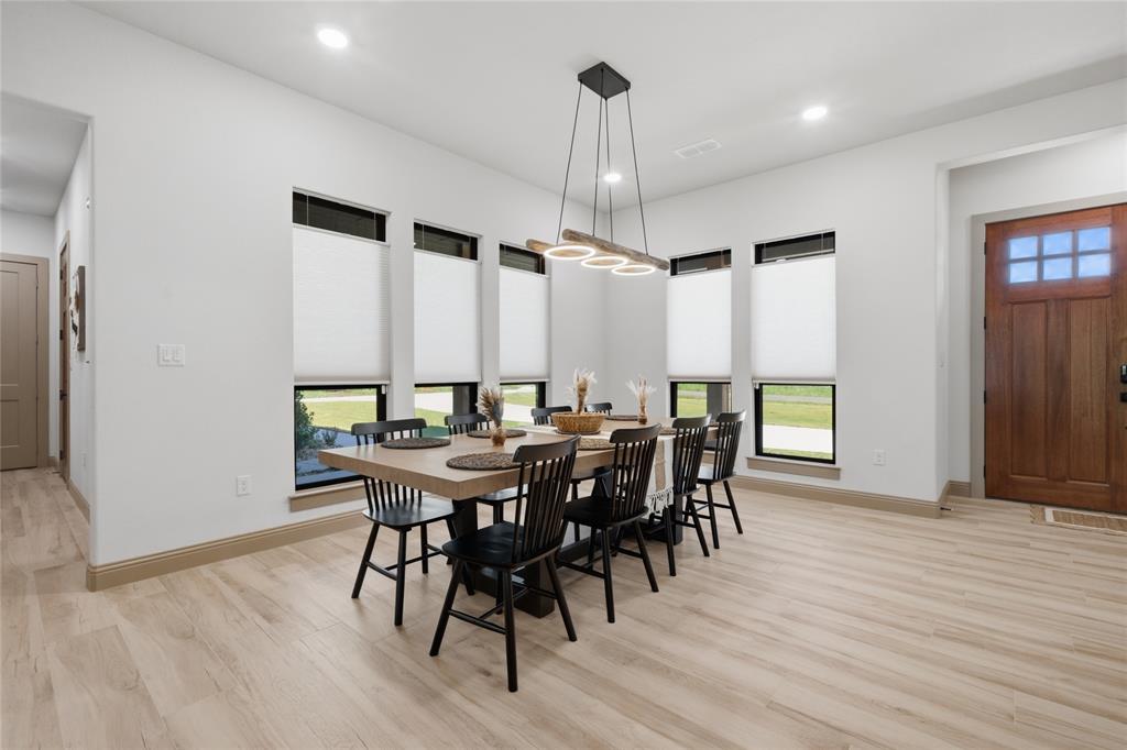 958 Cedar Mills Road Gordonville, TX 76245 - Photo 12 of 40 a view of a a dining room with furniture window and wooden floor