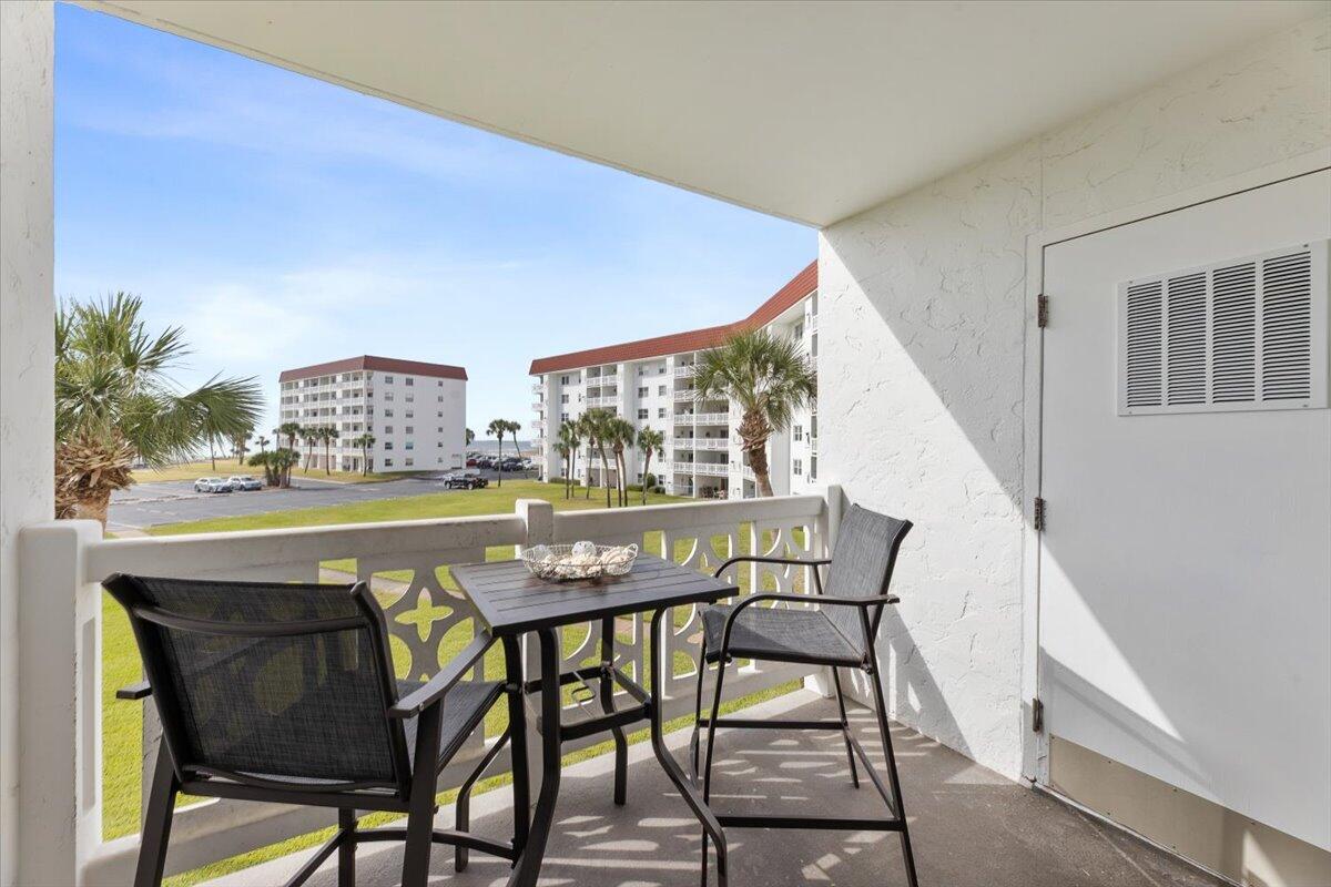 909 Santa Rosa Boulevard, Unit 138 Fort Walton Beach, FL 32548 - Photo 14 of 32 a view of a dining room with furniture and a large window