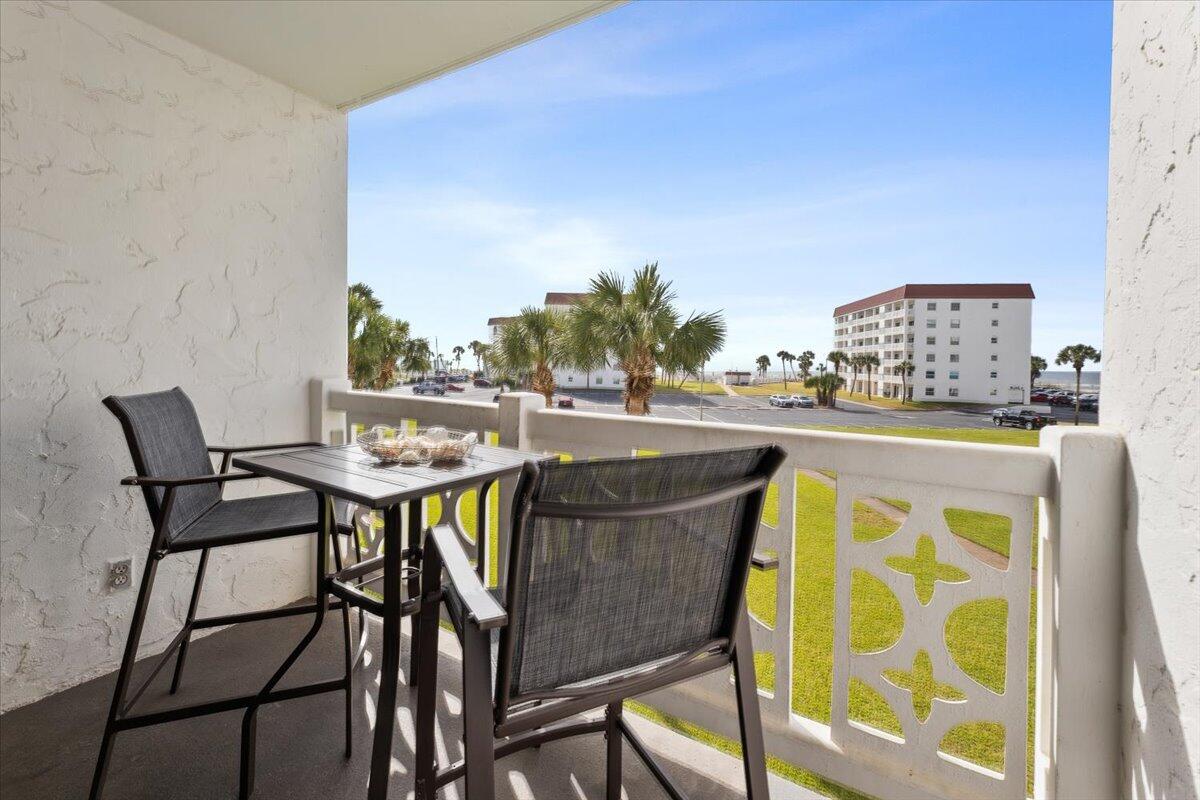 909 Santa Rosa Boulevard, Unit 138 Fort Walton Beach, FL 32548 - Photo 15 of 32 a view of a dining table and chairs with the table in the balcony