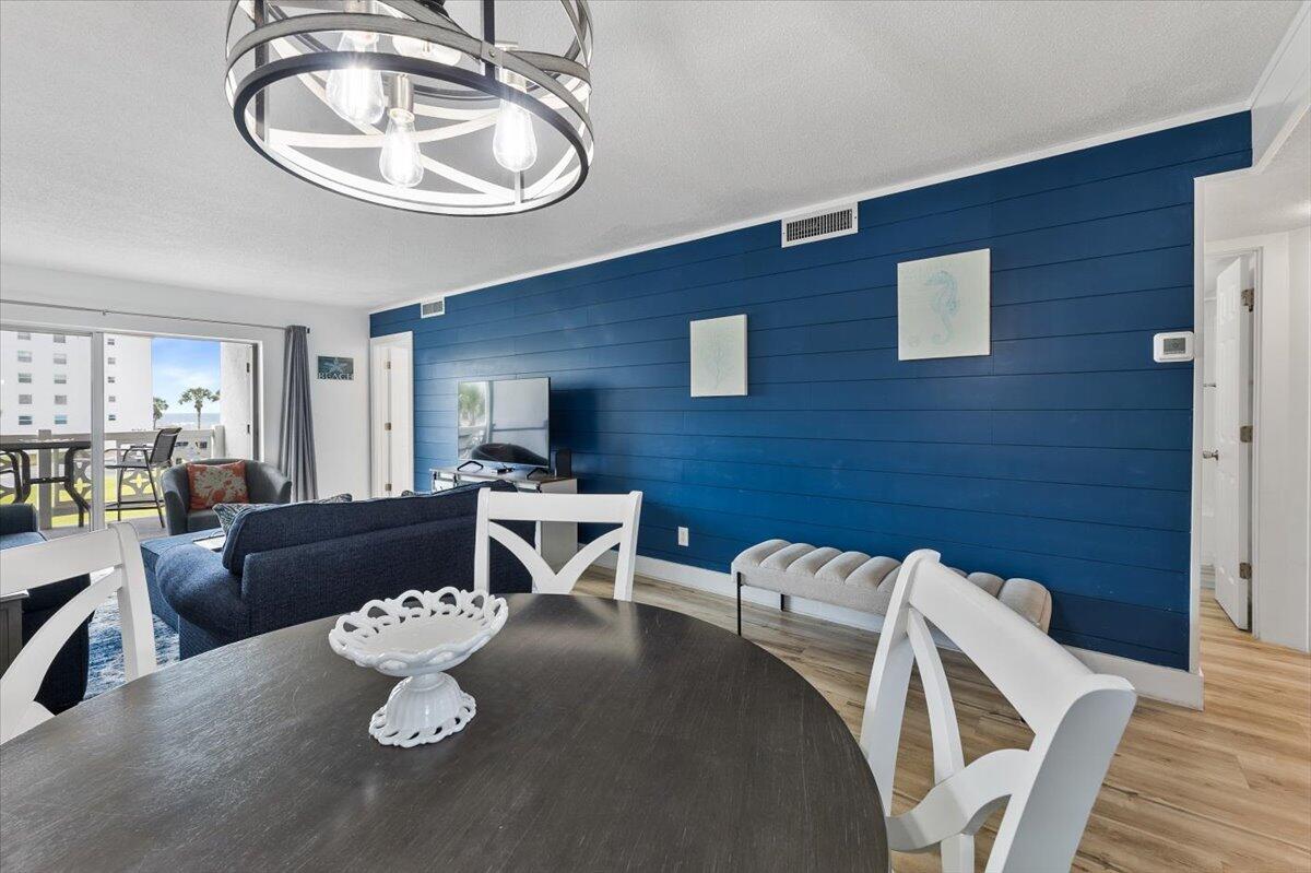 909 Santa Rosa Boulevard, Unit 138 Fort Walton Beach, FL 32548 - Photo 4 of 32 a living room with furniture flowerpot and wooden floor