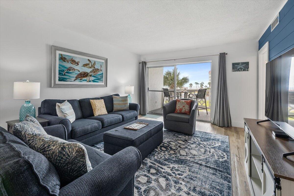 909 Santa Rosa Boulevard, Unit 138 Fort Walton Beach, FL 32548 - Photo 5 of 32 a living room with furniture and a couch