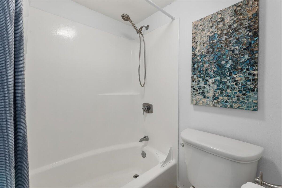 909 Santa Rosa Boulevard, Unit 138 Fort Walton Beach, FL 32548 - Photo 10 of 32 a bathroom with a toilet and shower