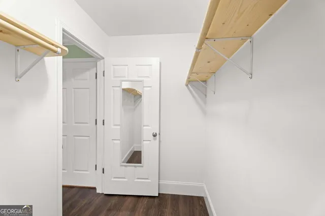 a view of an entryway with wooden floor