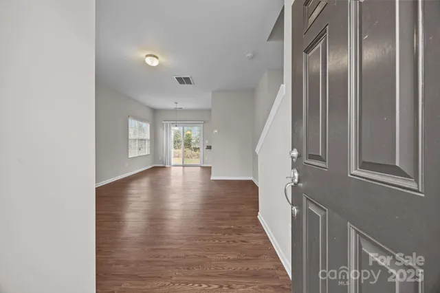 a view of entryway with wooden floor