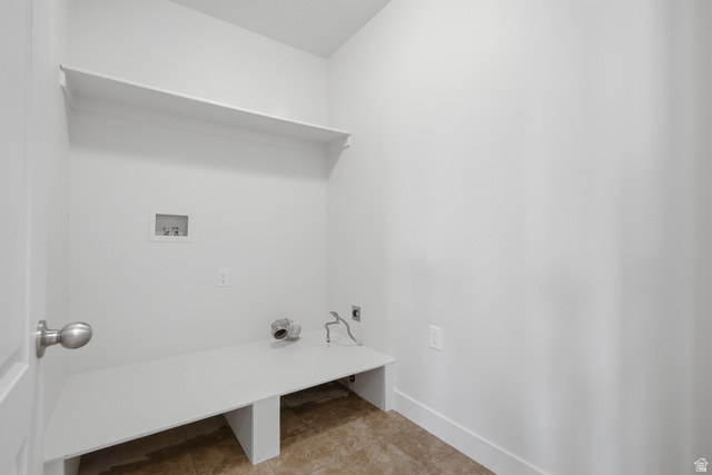 1252 Skyline Road Saratoga Springs, UT 84045 - Photo 42 of 51 Dedicated laundry space featuring a built-in shelf, built-in counter, and tile flooring