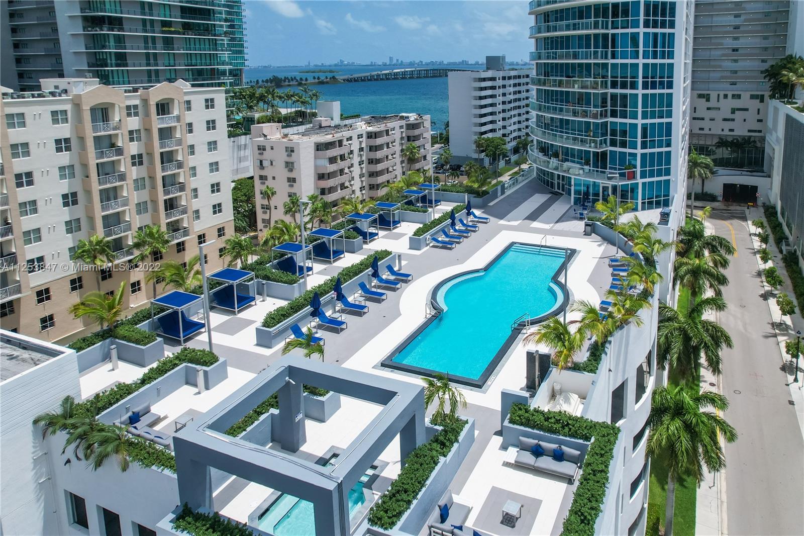 480 Northeast 30th Street, Unit 2003 Miami, FL 33137 - Photo 15 of 17 a view of swimming pool with outdoor seating and plants