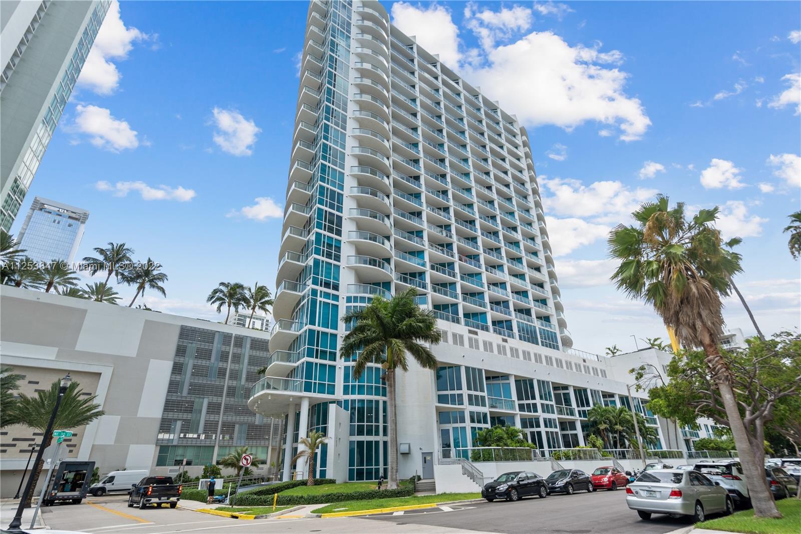 480 Northeast 30th Street, Unit 2003 Miami, FL 33137 - Photo 16 of 17 a city street lined with buildings and trees