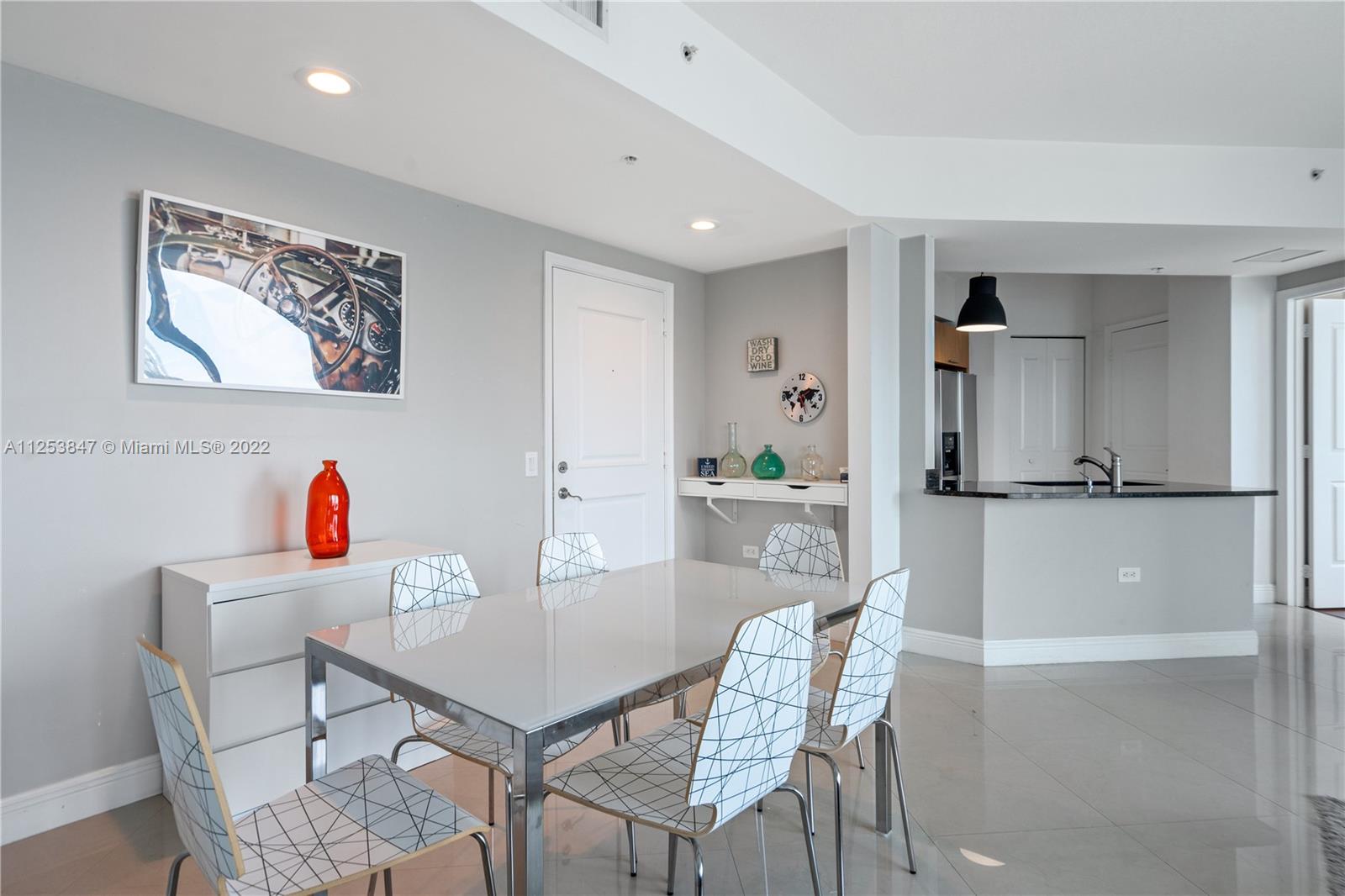480 Northeast 30th Street, Unit 2003 Miami, FL 33137 - Photo 6 of 17 a view of a dining room with furniture