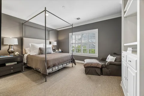 a large white kitchen with a sink stainless steel appliances and cabinets