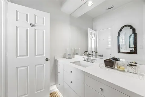 a bedroom with a bed couch and window