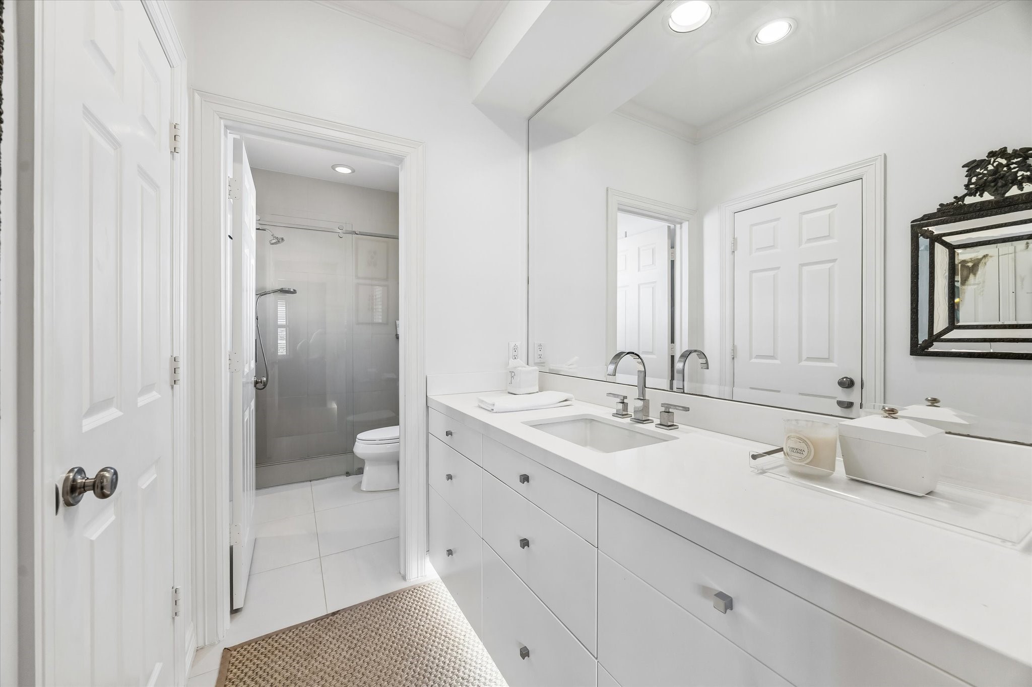 2627 Sutton Court Houston, TX 77027 - Photo 24 of 34 a bathroom with a granite countertop sink mirror and double
