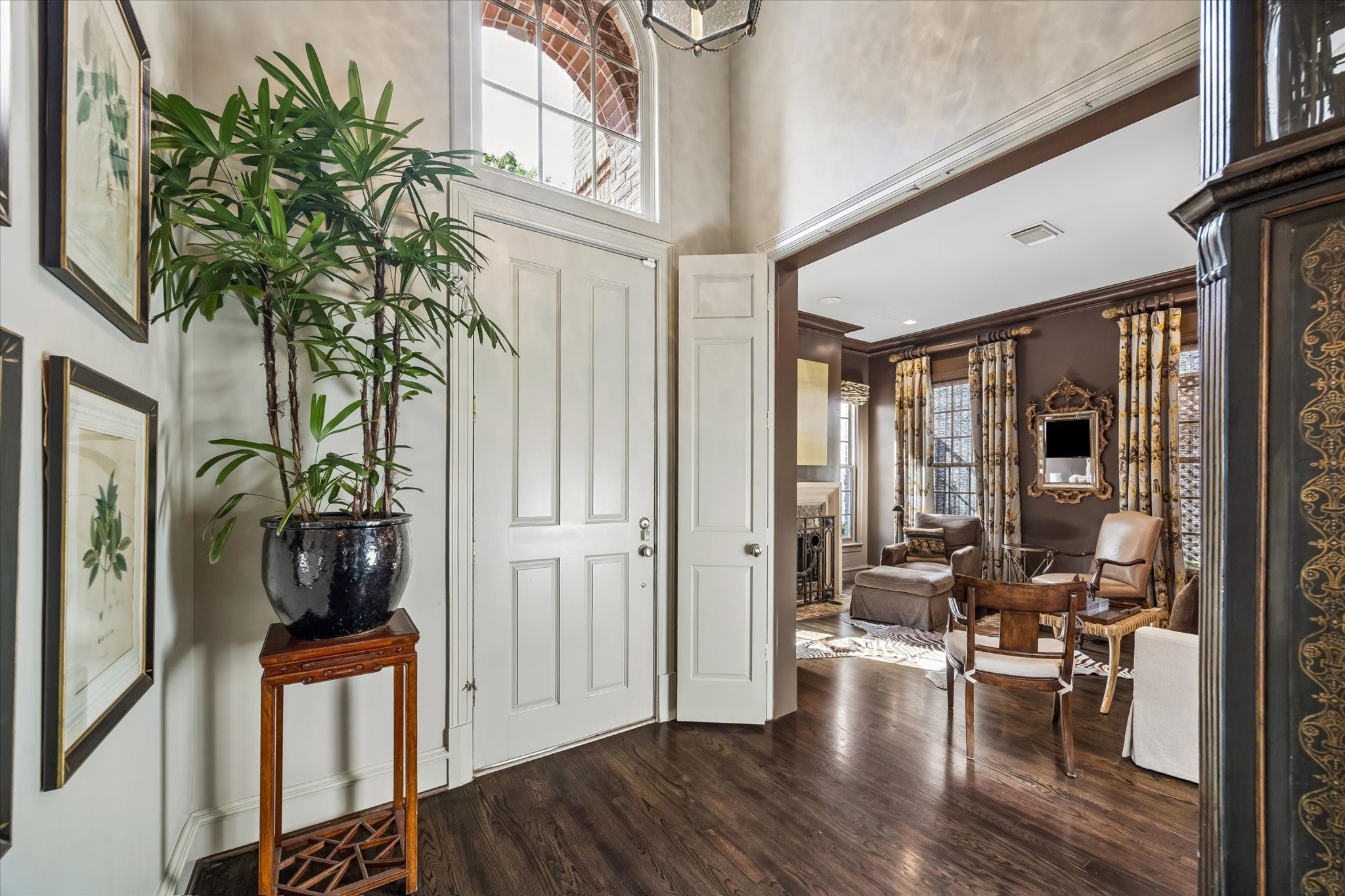 2627 Sutton Court Houston, TX 77027 - Photo 28 of 34 a view of a hallway with wooden floor and a living room