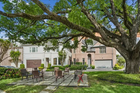 a view of a house with potted plants