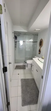 a view of a chairs and table in the roof deck