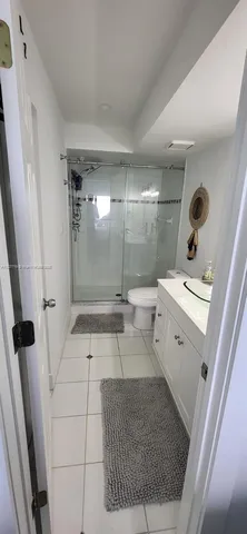 a view of a chairs and table in the roof deck