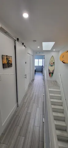 a bedroom with a bed and cabinets