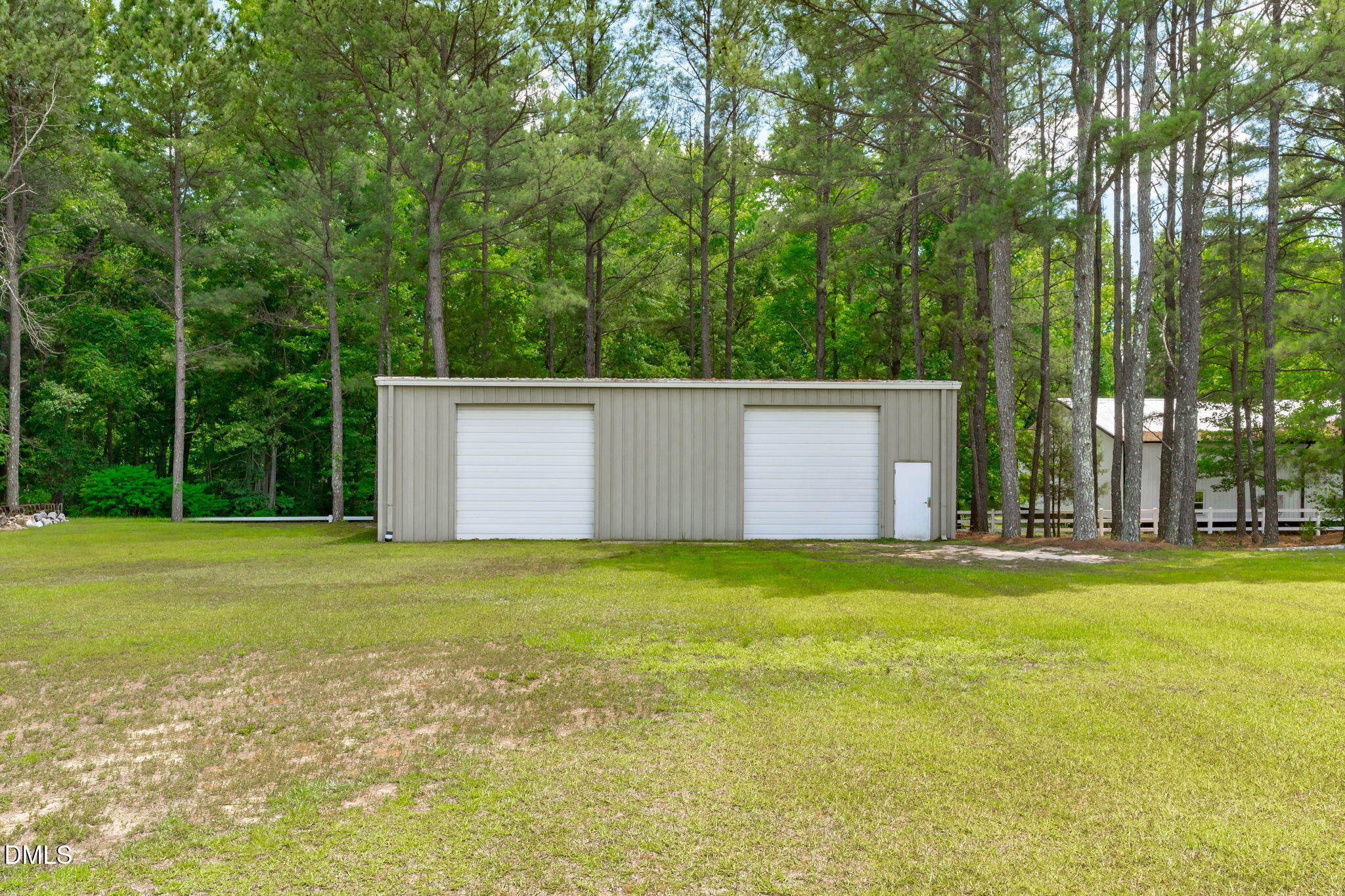 10917 Jordan Road Raleigh, NC 27603 - Photo 54 of 58 a view of a big yard with a house and large trees