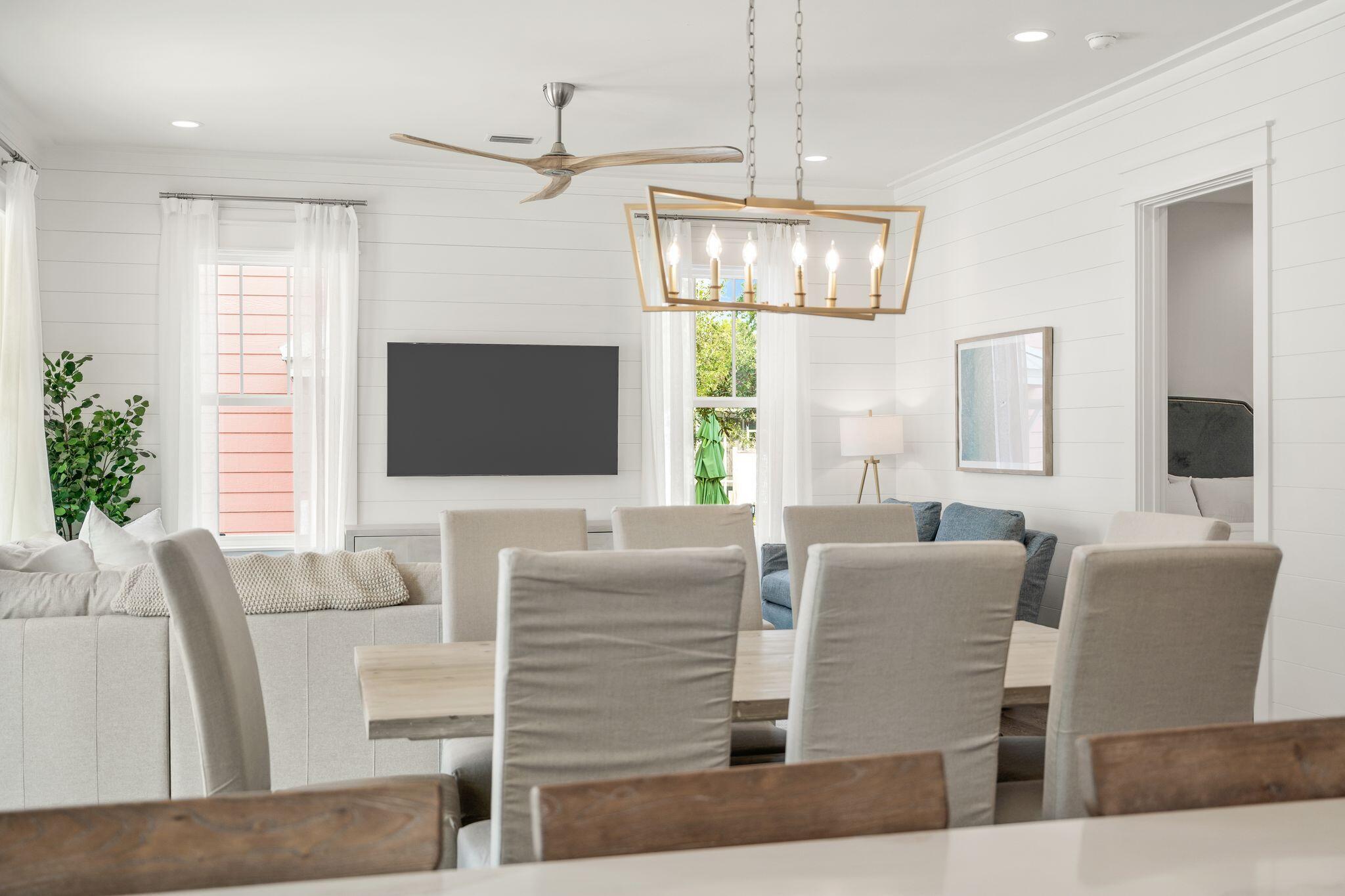 76 Dalton Drive Santa Rosa Beach, FL 32459 - Photo 11 of 71 a living room with furniture a flat screen tv and a chandelier