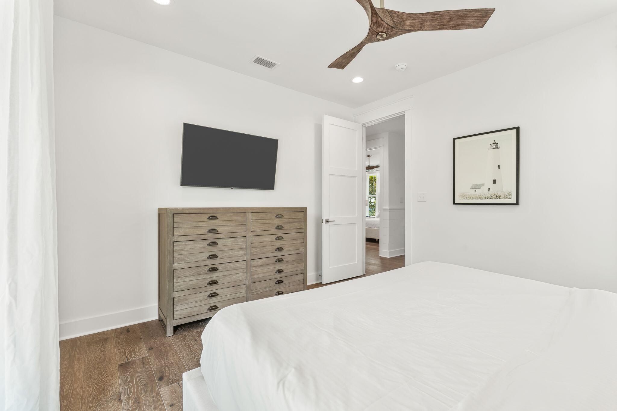 76 Dalton Drive Santa Rosa Beach, FL 32459 - Photo 23 of 71 a bedroom with a bed and a flat screen tv