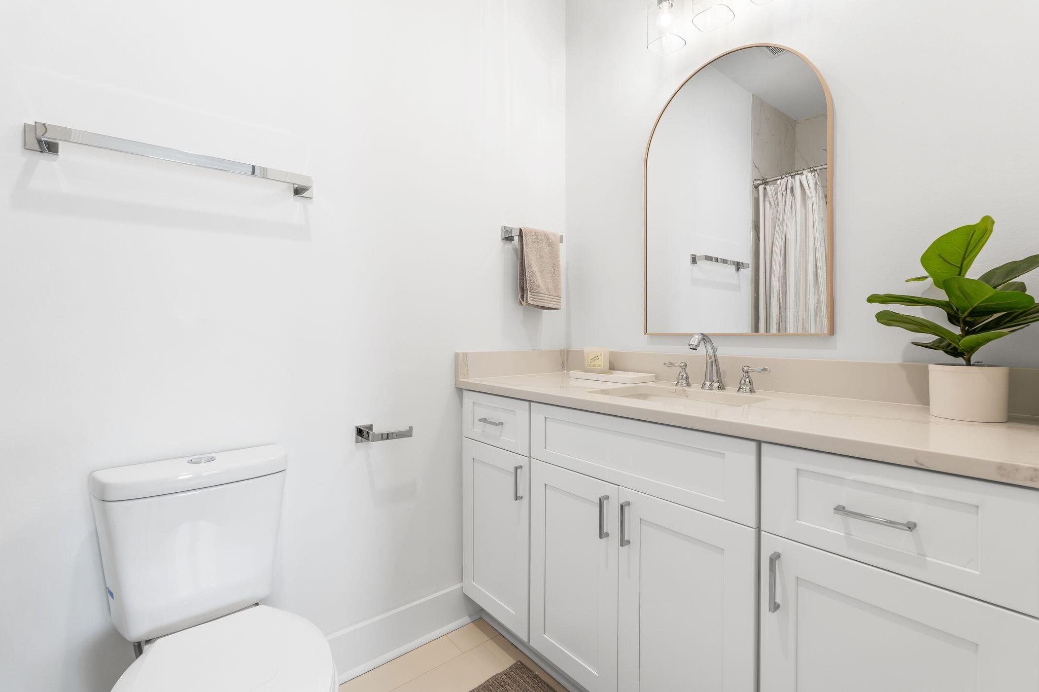 76 Dalton Drive Santa Rosa Beach, FL 32459 - Photo 31 of 71 a bathroom with a toilet sink and mirror