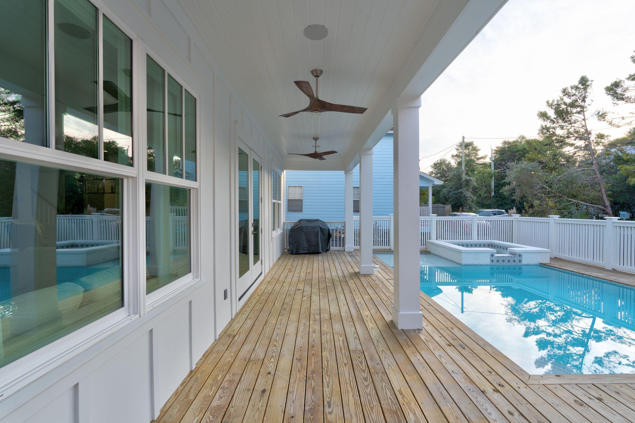 76 Dalton Drive Santa Rosa Beach, FL 32459 - Photo 58 of 71 a view of balcony with a floor to ceiling window and wooden floor