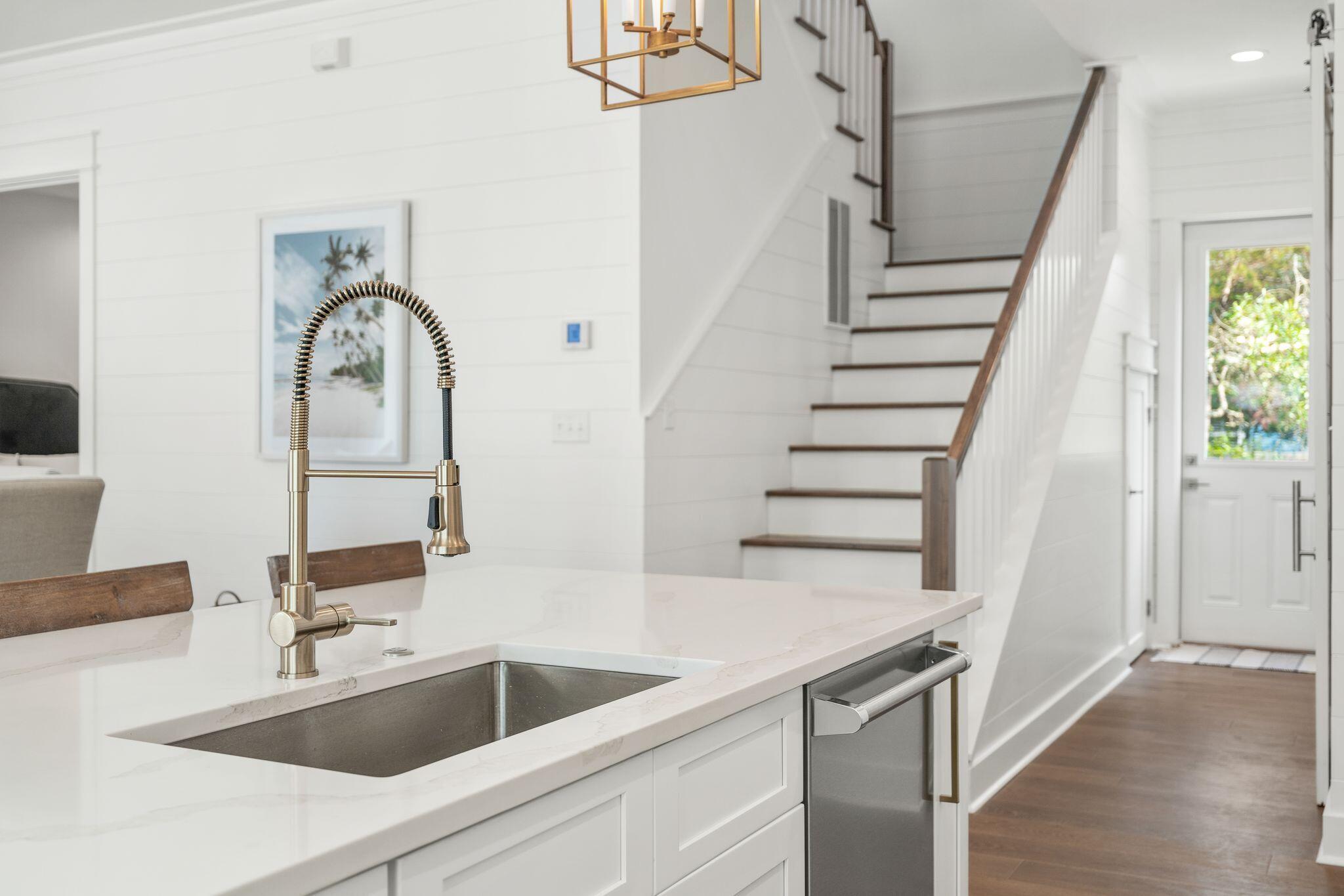 76 Dalton Drive Santa Rosa Beach, FL 32459 - Photo 6 of 71 a close view of a sink a faucet and appliance in the kitchen