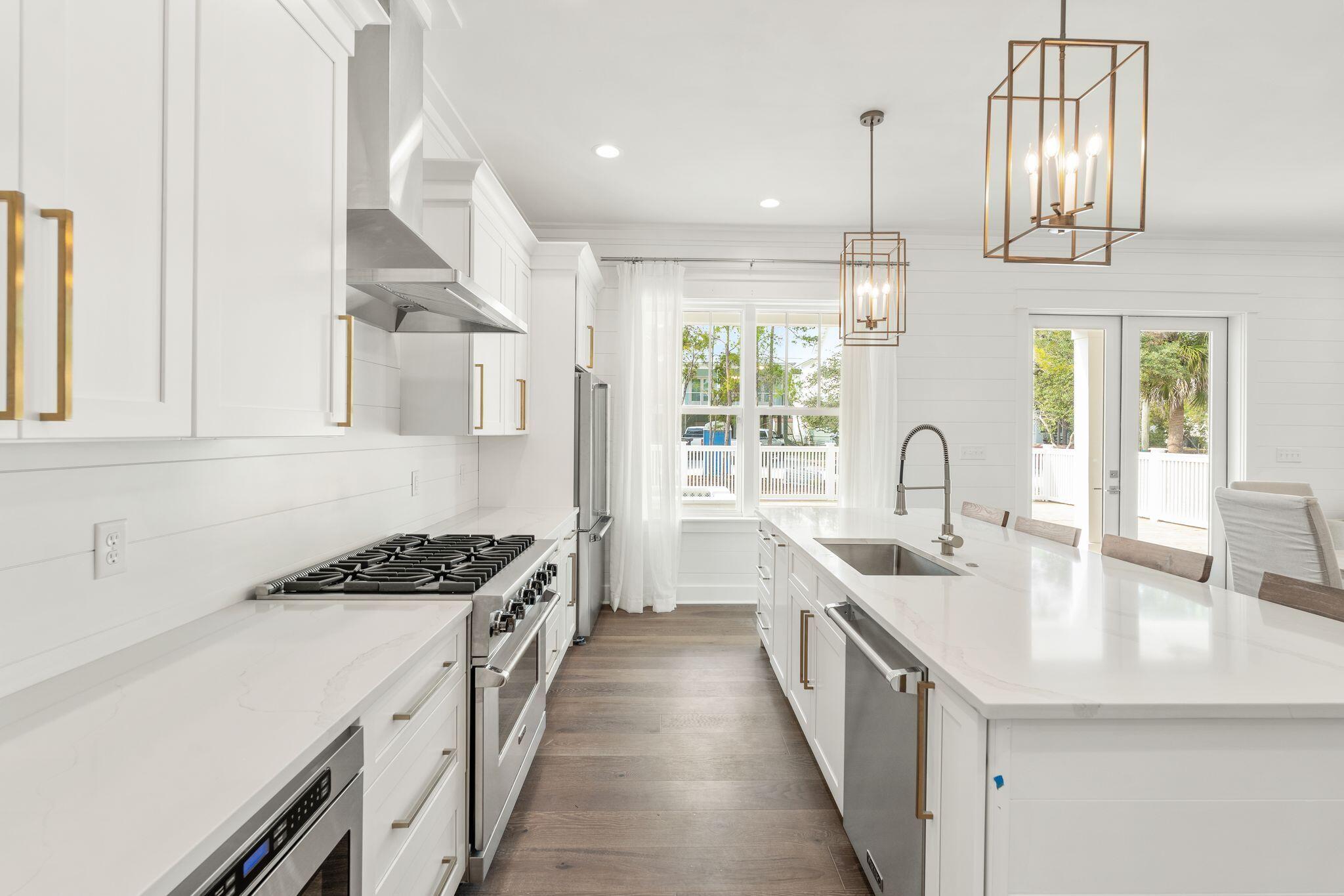 76 Dalton Drive Santa Rosa Beach, FL 32459 - Photo 8 of 71 a kitchen with stainless steel appliances a sink stove and cabinets