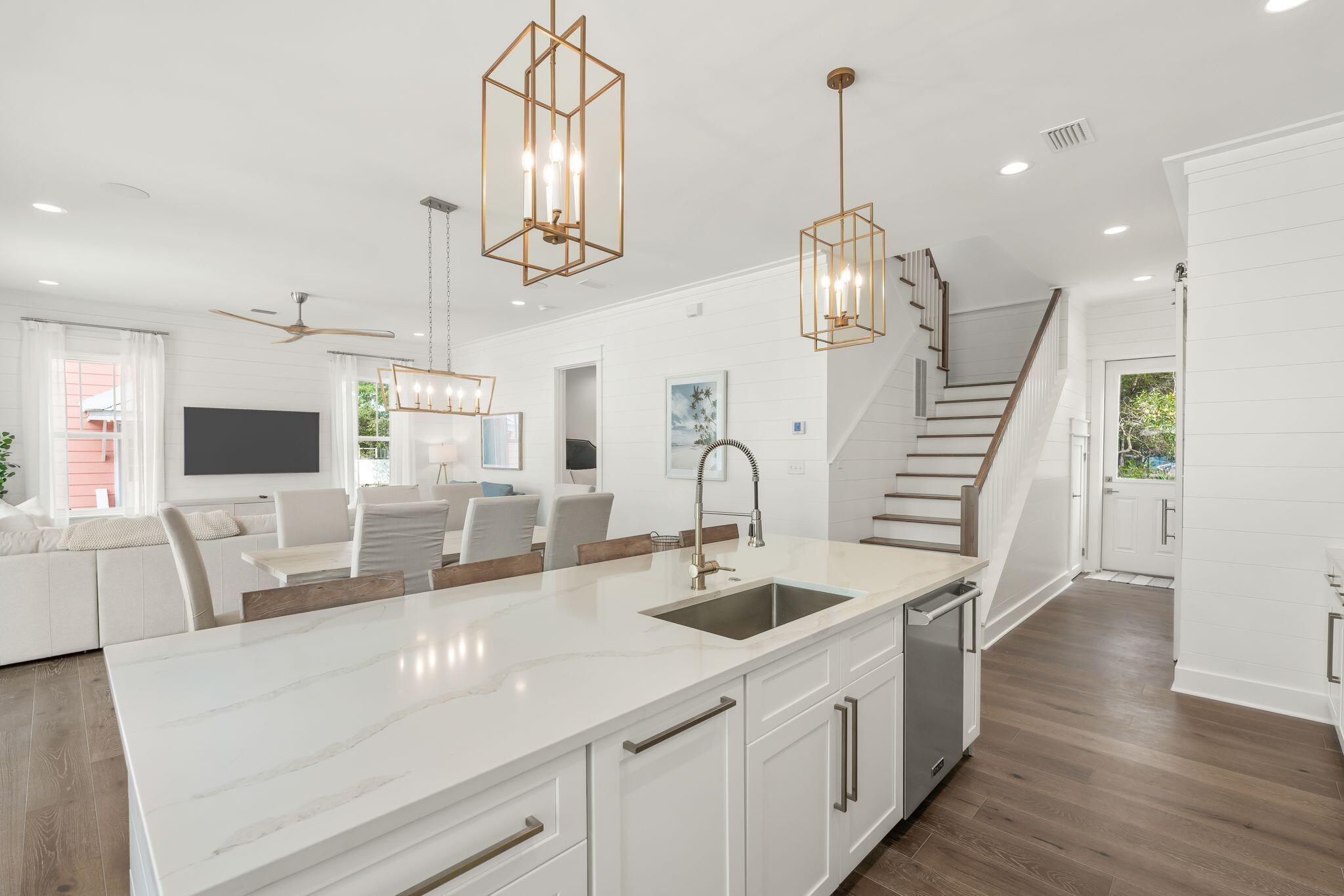 76 Dalton Drive Santa Rosa Beach, FL 32459 - Photo 9 of 71 a kitchen with stainless steel appliances kitchen island a large island in the center