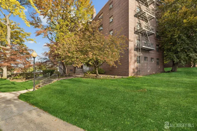 a view of a building with a yard