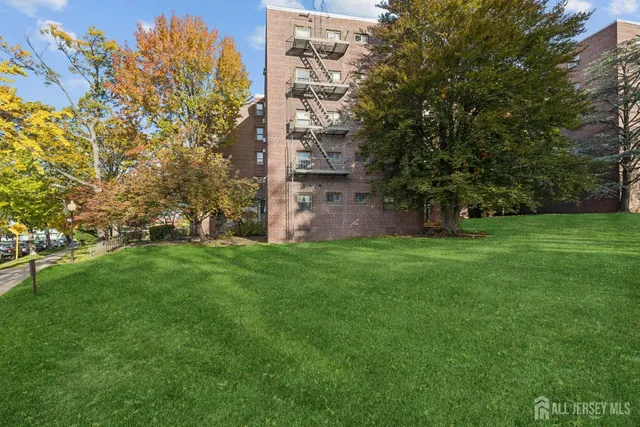 a view of a garden with a building