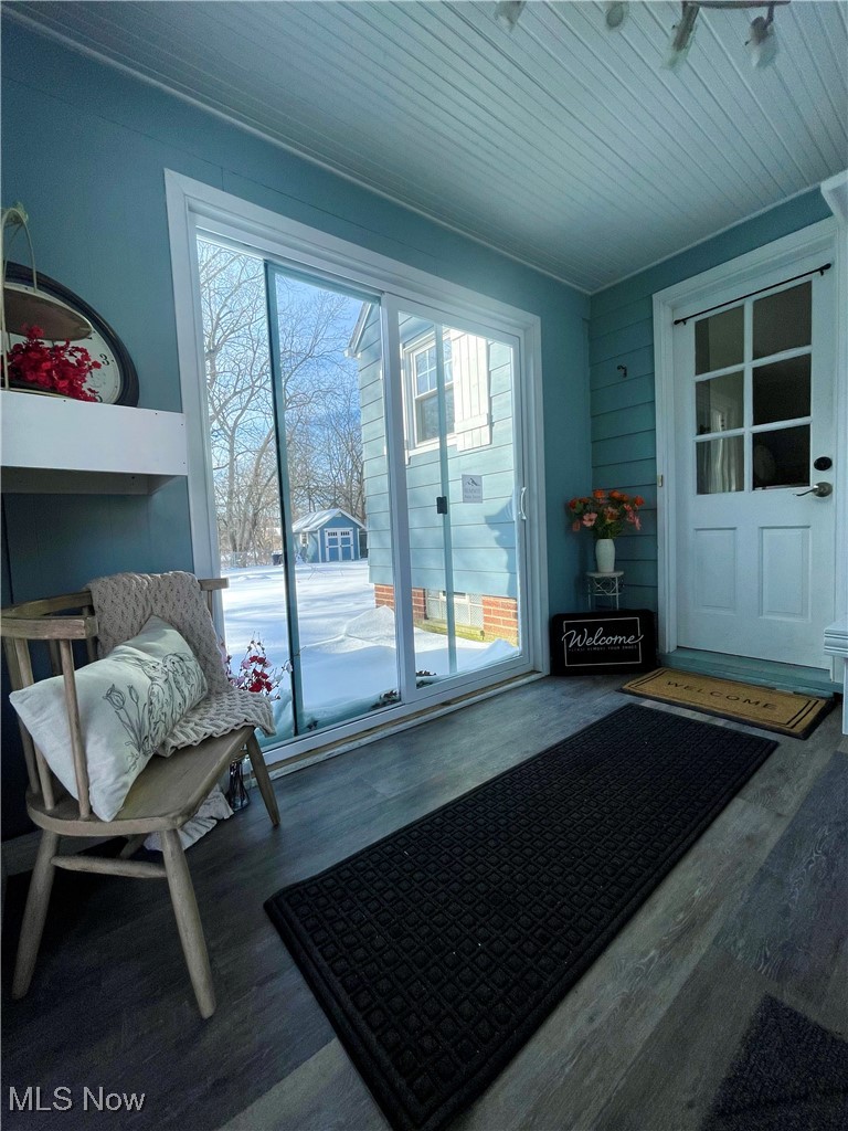 1544 Edgefield Road Lyndhurst, OH 44124 - Photo 3 of 36 Doorway to outside with healthy amount of natural light, wood finished floors, wood ceiling, and wood walls