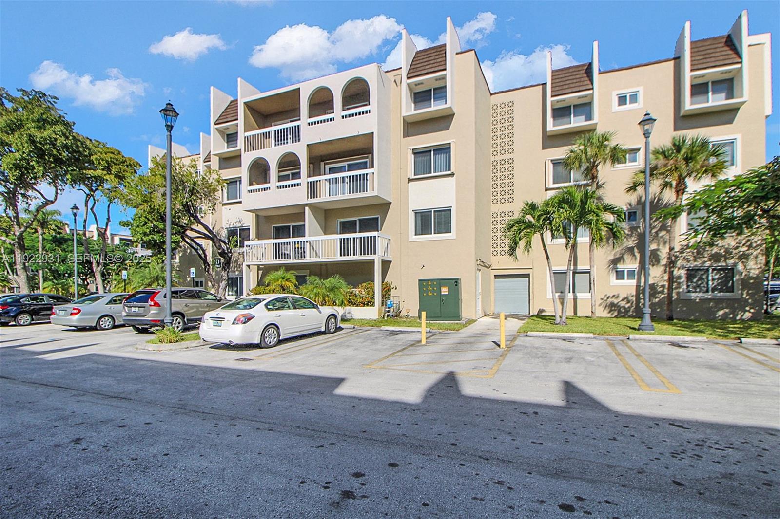 7700 Camino Real, Unit D101 Miami, FL 33143 - Photo 13 of 13 a view of a street with tall buildings