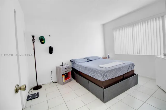 a living room with table and white walls