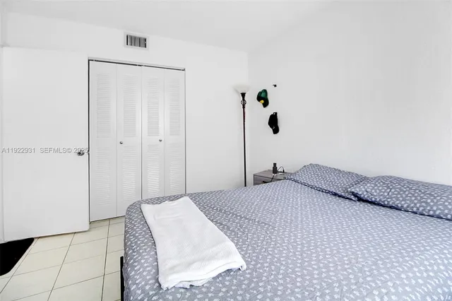 a bedroom with a bed and a shower