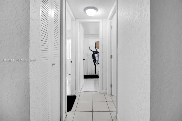 a view of a hallway view with staircase