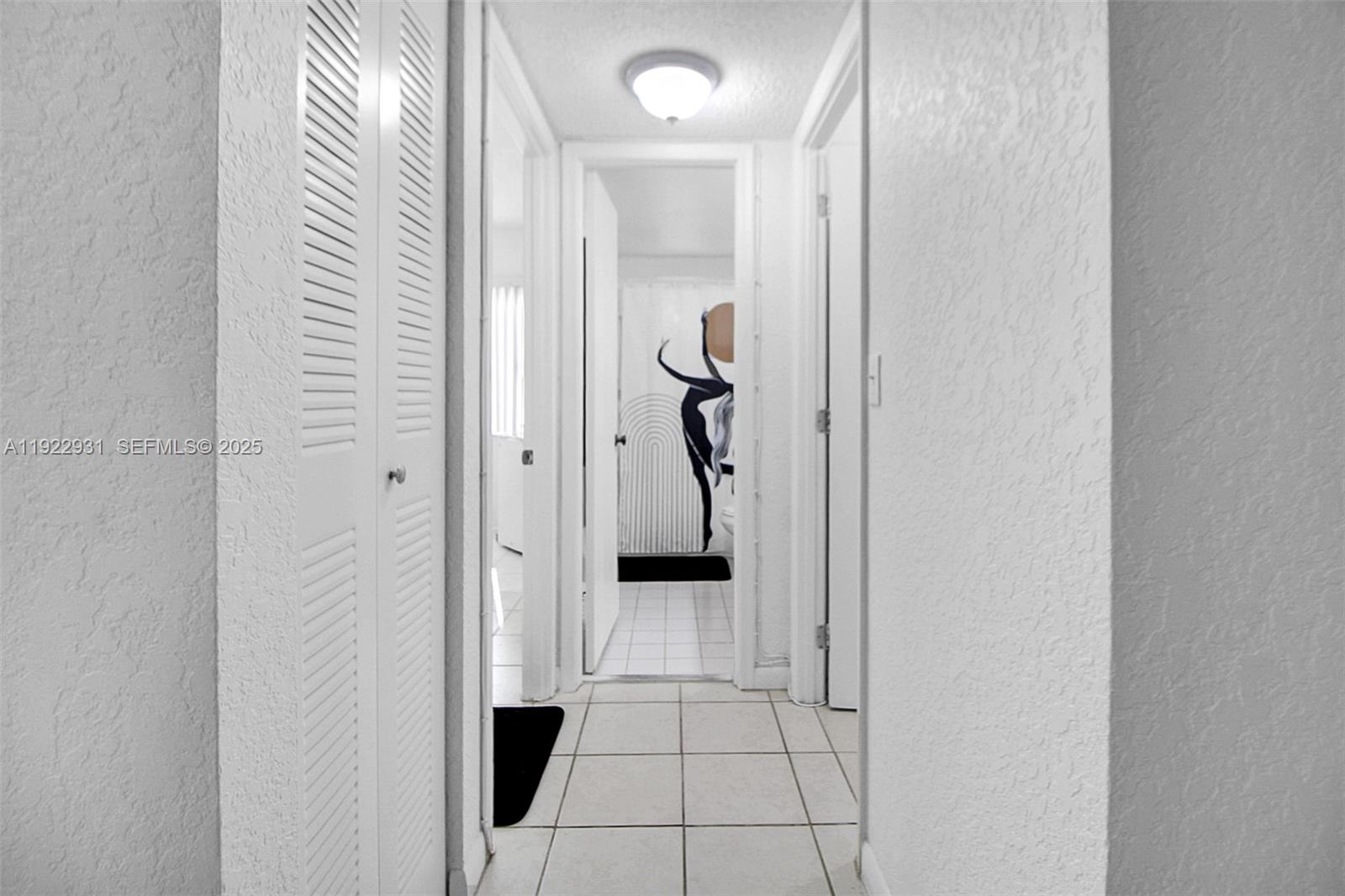 7700 Camino Real, Unit D101 Miami, FL 33143 - Photo 9 of 13 a view of a hallway view with staircase