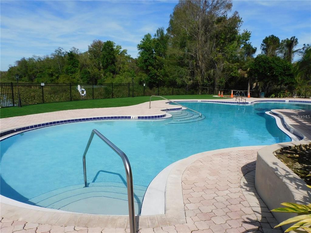 236 Afton Square, Unit 305 Altamonte Springs, FL 32714 - Photo 14 of 30 a view of a swimming pool with a yard