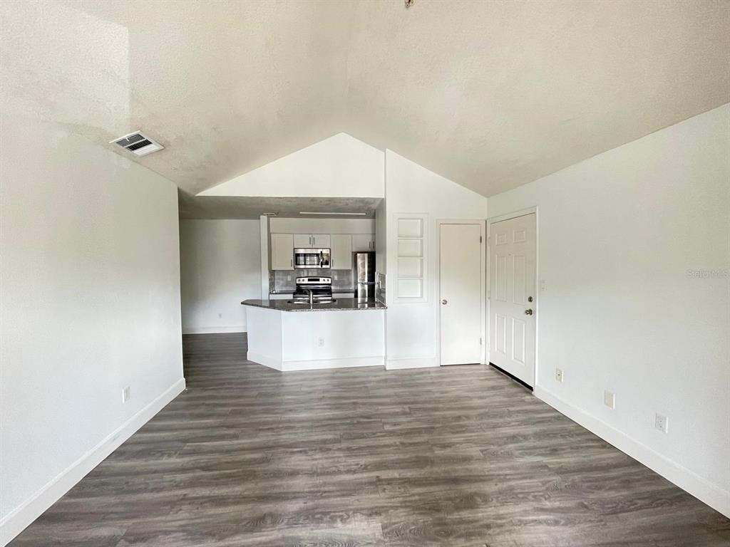 236 Afton Square, Unit 305 Altamonte Springs, FL 32714 - Photo 24 of 30 a view of empty room with wooden floor