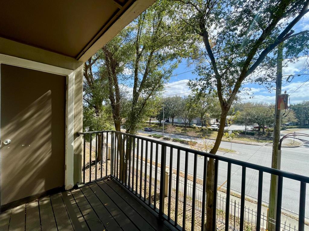 236 Afton Square, Unit 305 Altamonte Springs, FL 32714 - Photo 29 of 30 a view of a balcony with wooden fence