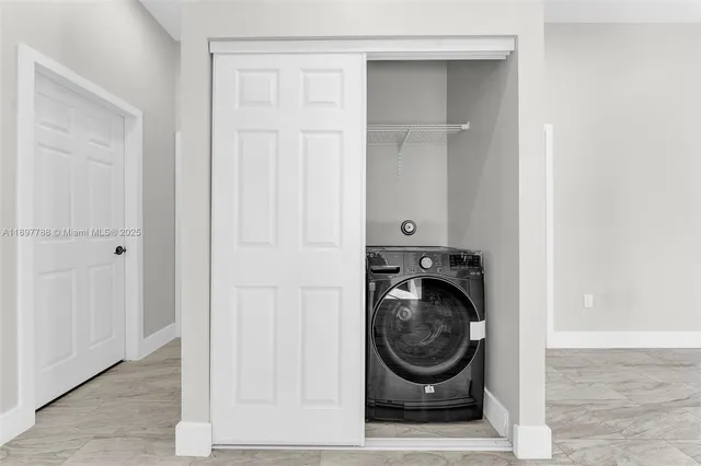 a view of washer and dryer in a utility room