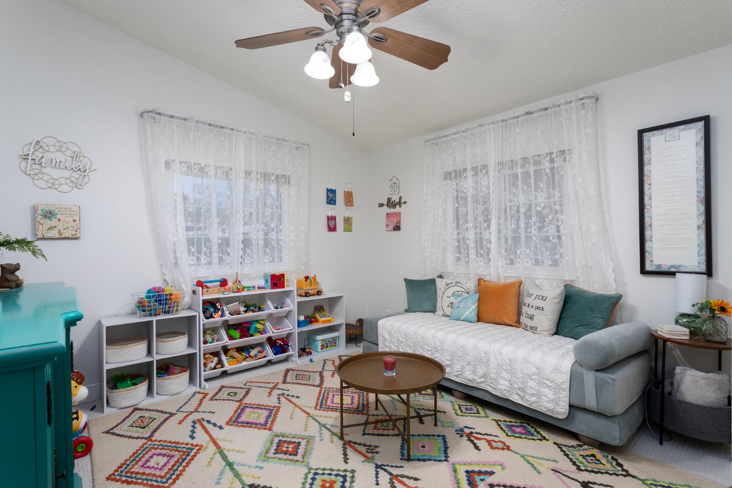 8701 Highway 41, Unit 52 Fresno, CA 93720 - Photo 13 of 66 a living room with furniture and a baby crib