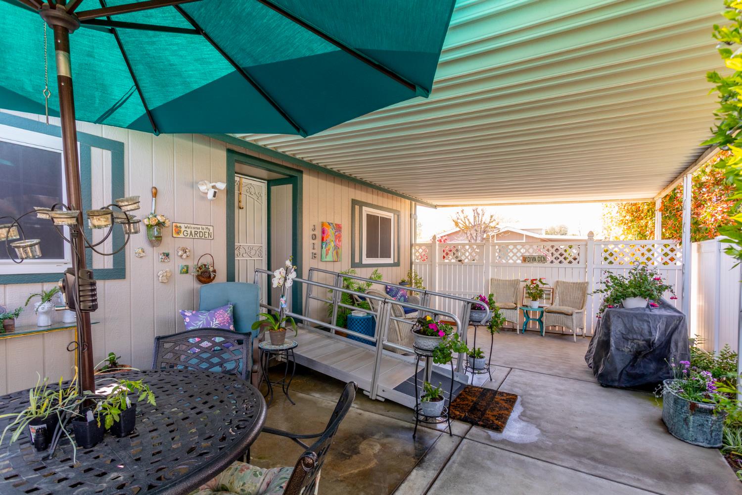 8701 Highway 41, Unit 52 Fresno, CA 93720 - Photo 22 of 66 a outdoor living space with furniture and garden