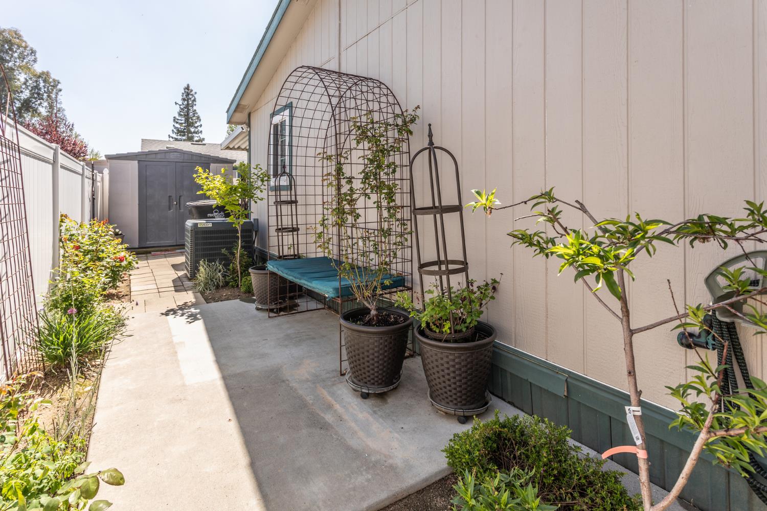 8701 Highway 41, Unit 52 Fresno, CA 93720 - Photo 26 of 66 a front view of a house with a garden