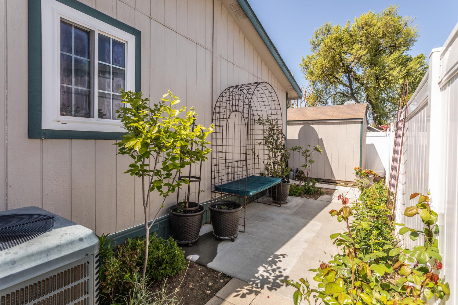 8701 Highway 41, Unit 52 Fresno, CA 93720 - Photo 28 of 66 a potted plant sitting in front of a house